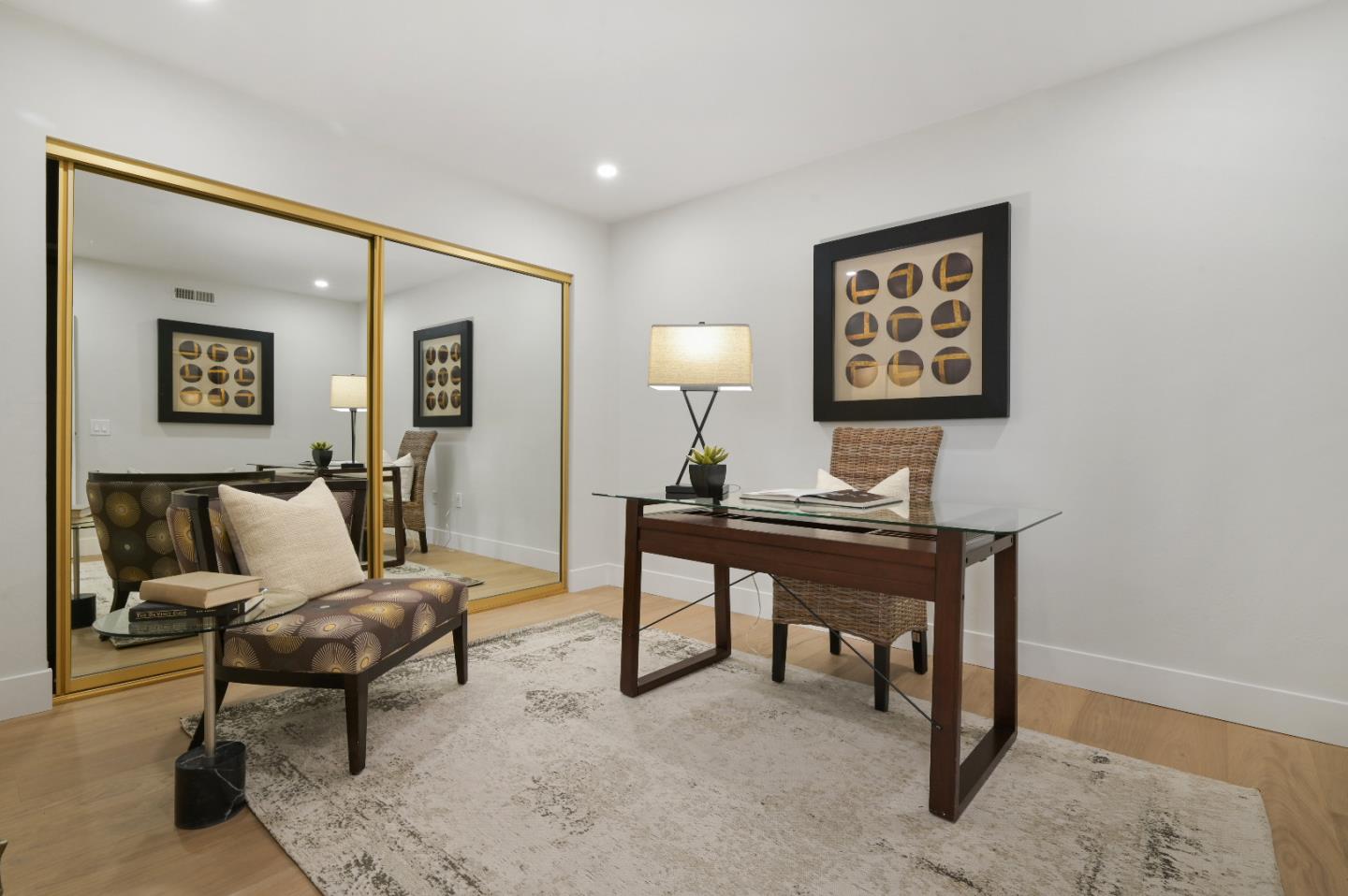 110 Park Road, Unit 502 Burlingame, CA 94010 - Photo 27 of 43 a living room with furniture a lamp paintings and a window