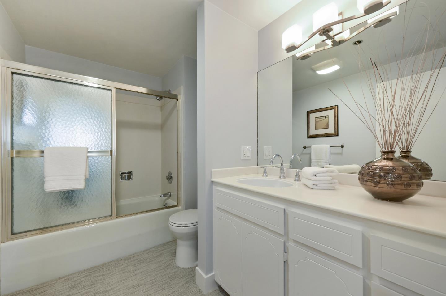 110 Park Road, Unit 502 Burlingame, CA 94010 - Photo 29 of 43 a bathroom with a sink a toilet and shower