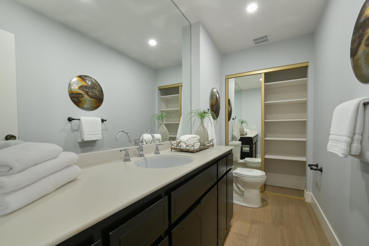 110 Park Road, Unit 502 Burlingame, CA 94010 - Photo 31 of 43 a bathroom with a granite countertop sink mirror vanity and toilet