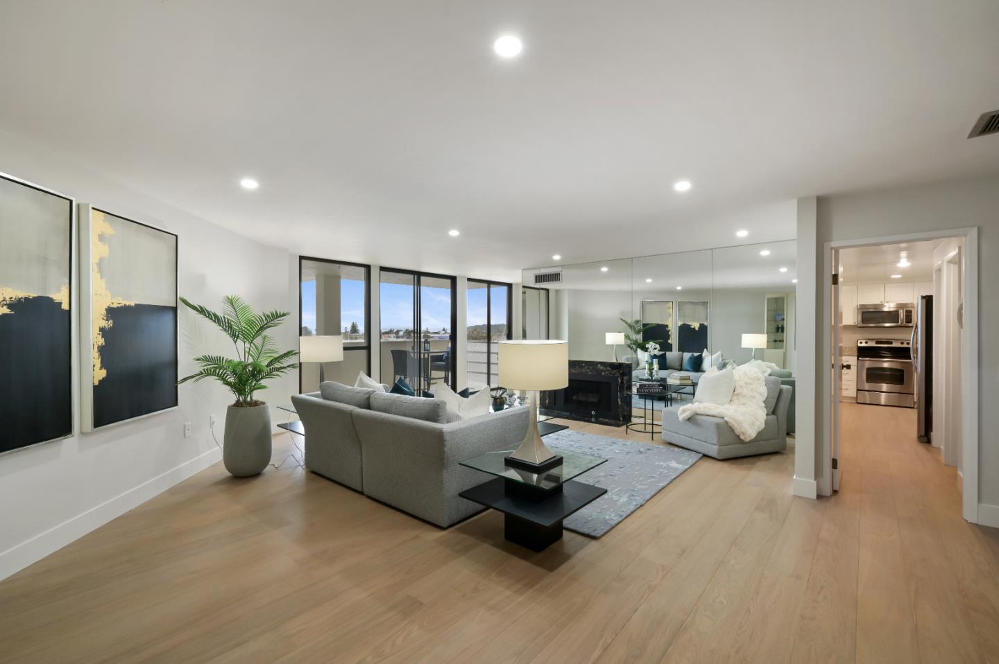 110 Park Road, Unit 502 Burlingame, CA 94010 - Photo 4 of 43 a living room with furniture and potted plant