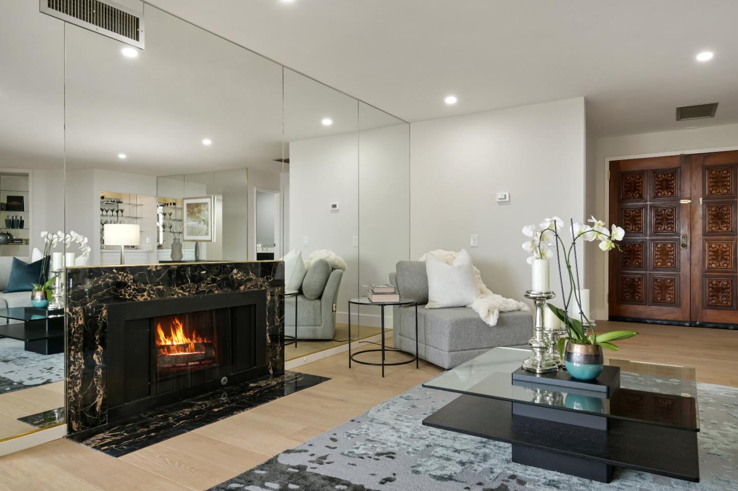 110 Park Road, Unit 502 Burlingame, CA 94010 - Photo 6 of 43 a living room with furniture a fireplace and a table