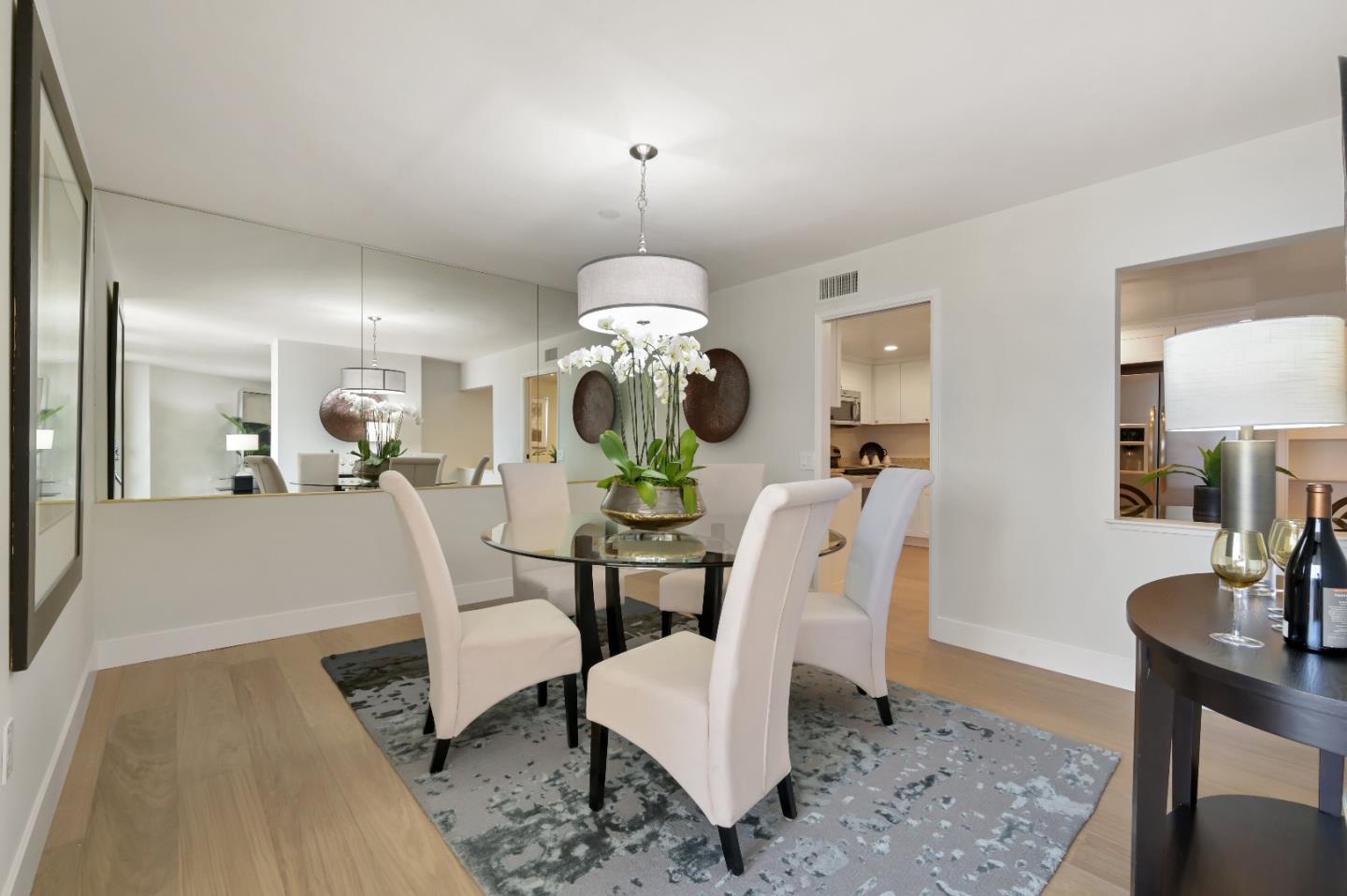 110 Park Road, Unit 502 Burlingame, CA 94010 - Photo 8 of 43 a view of a dining room with furniture and wooden floor