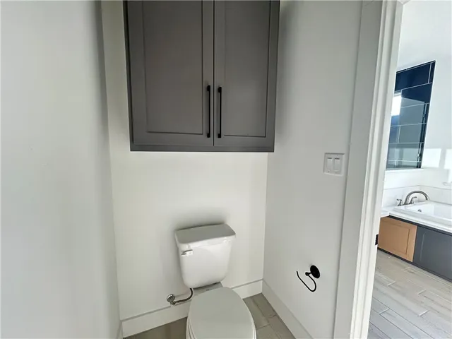 a bathroom with a toilet and a sink