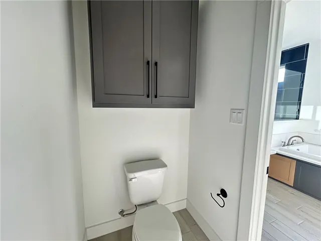 a bathroom with a toilet and a sink