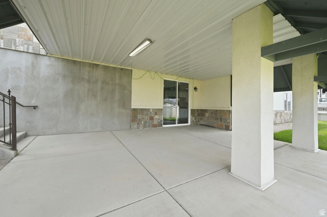 1002 West Temple Rim Lane Payson, UT 84651 - Photo 54 of 68 Expansive covered concrete patio featuring a metal ceiling, recessed lighting, and support columns