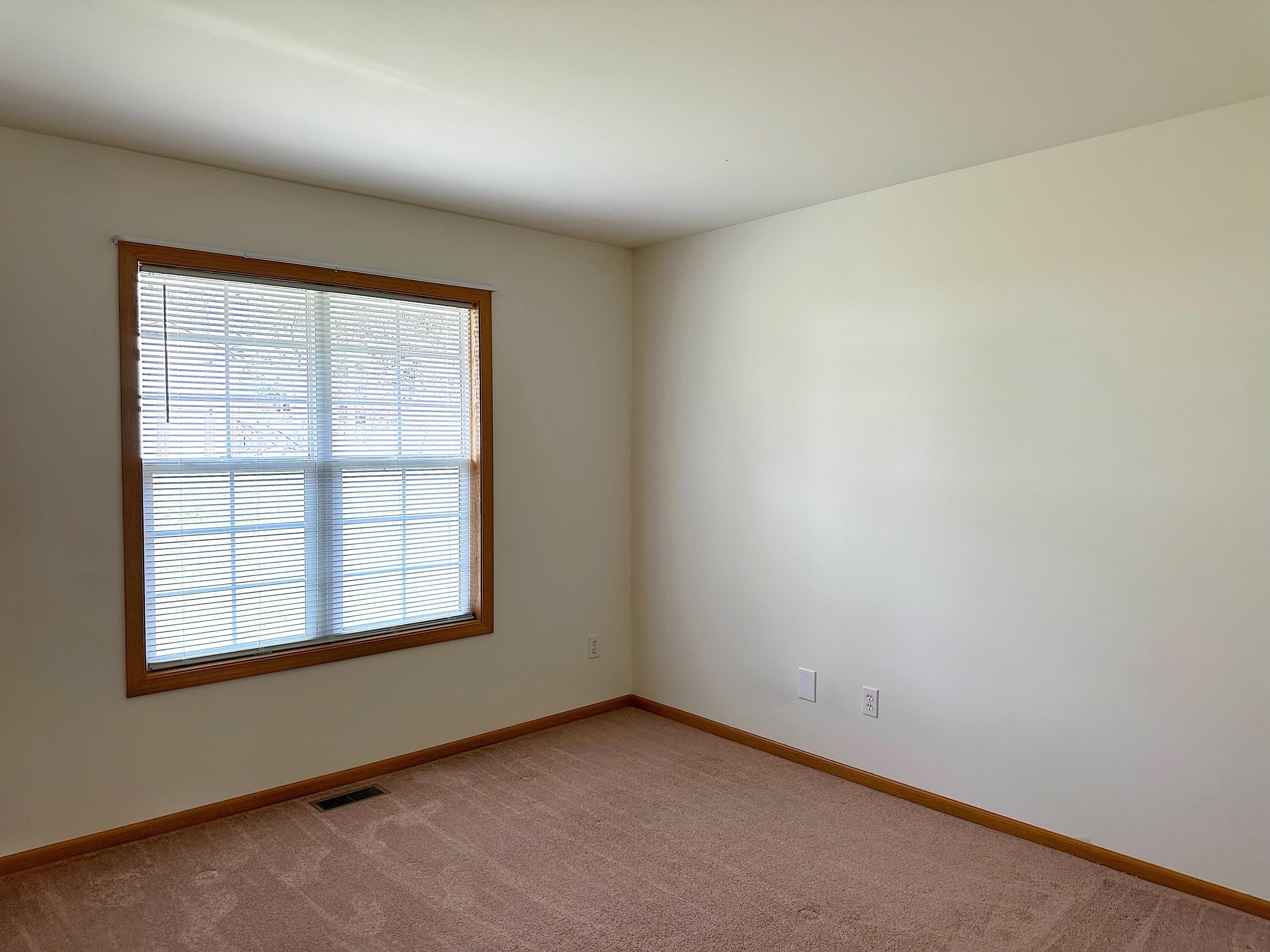 482 Fox Lane Walworth, WI 53184 - Photo 16 of 20 Bedroom 2 is spacious and overlooks the rea yard