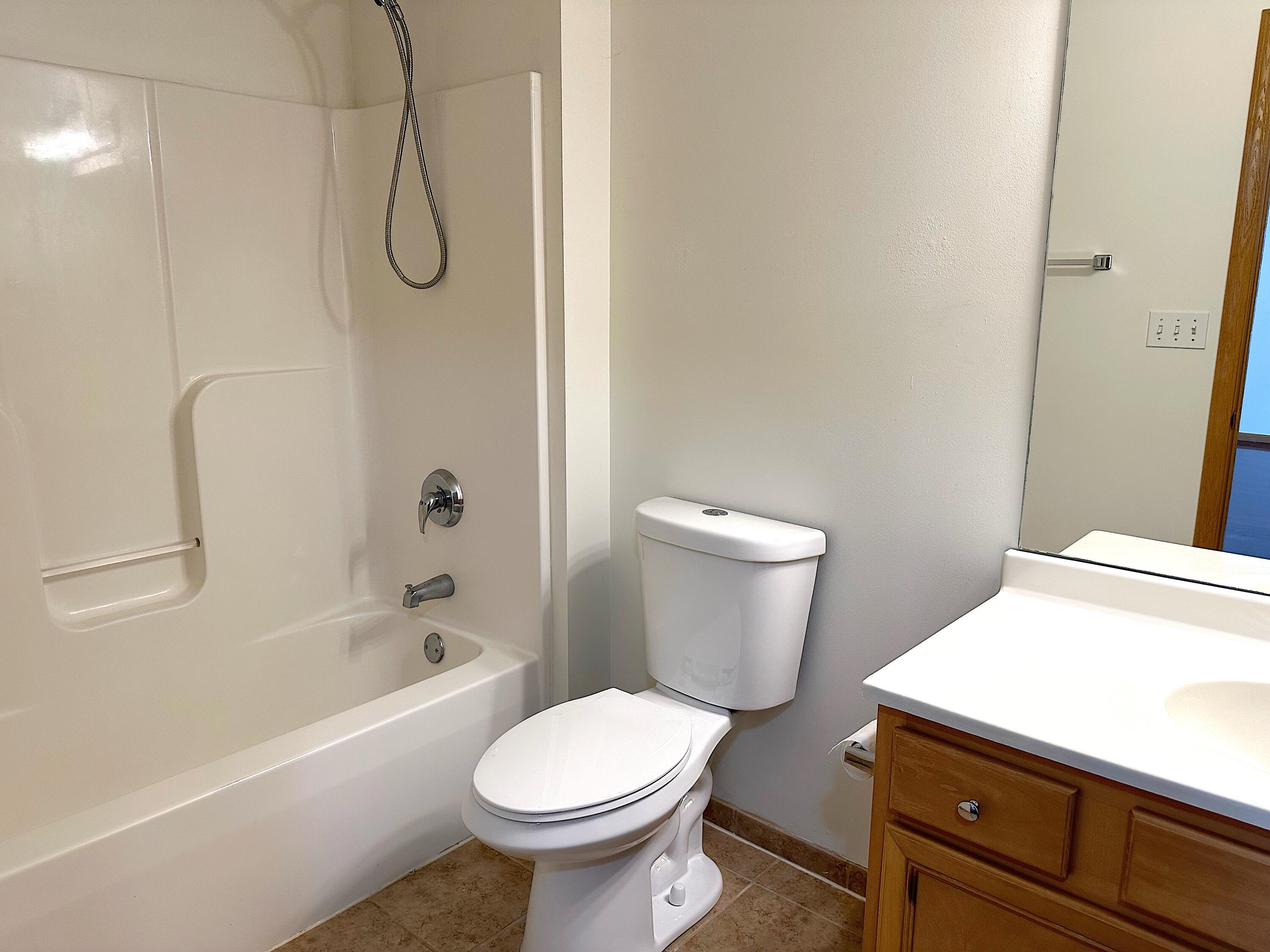 482 Fox Lane Walworth, WI 53184 - Photo 17 of 20 The Full Bath features a tile floor, tub/shower and single sink vanity