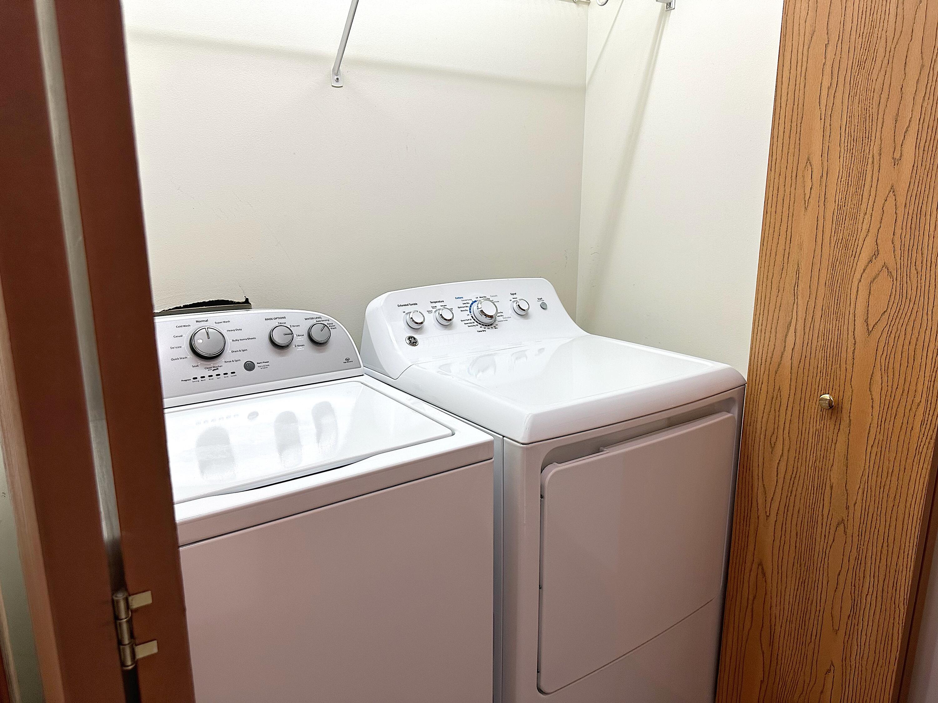 482 Fox Lane Walworth, WI 53184 - Photo 18 of 20 The Main Level Laundry Area has closet doors that can close your laundry equipment off from view when not in use