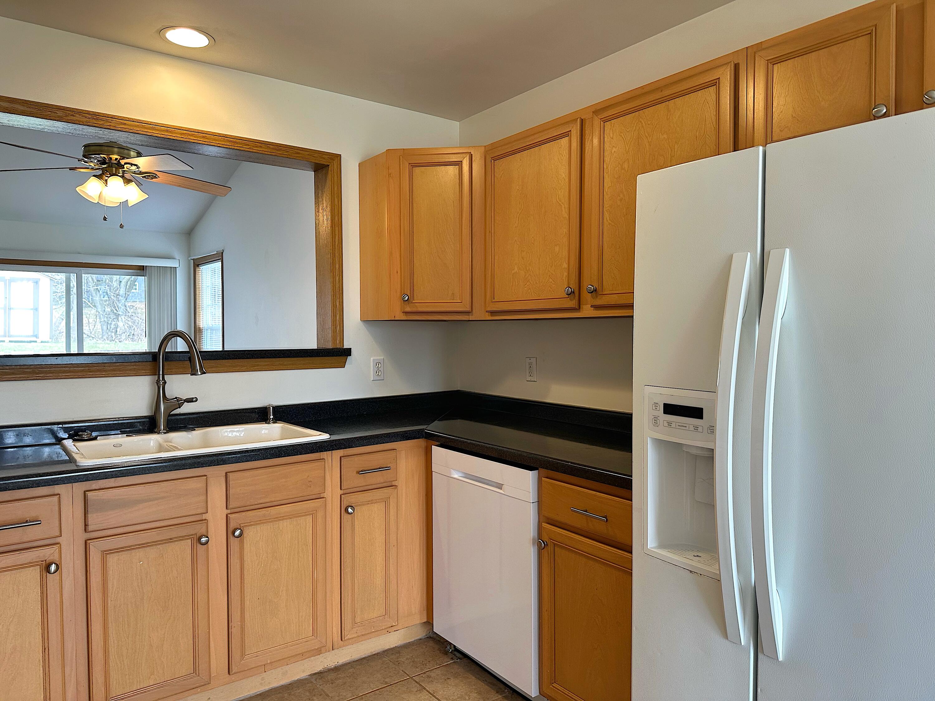 482 Fox Lane Walworth, WI 53184 - Photo 5 of 20 The kitchen comes with an electric oven/range, microwave, dishwasher and side-by-side refrigerator/freezer with water and ice dispenser