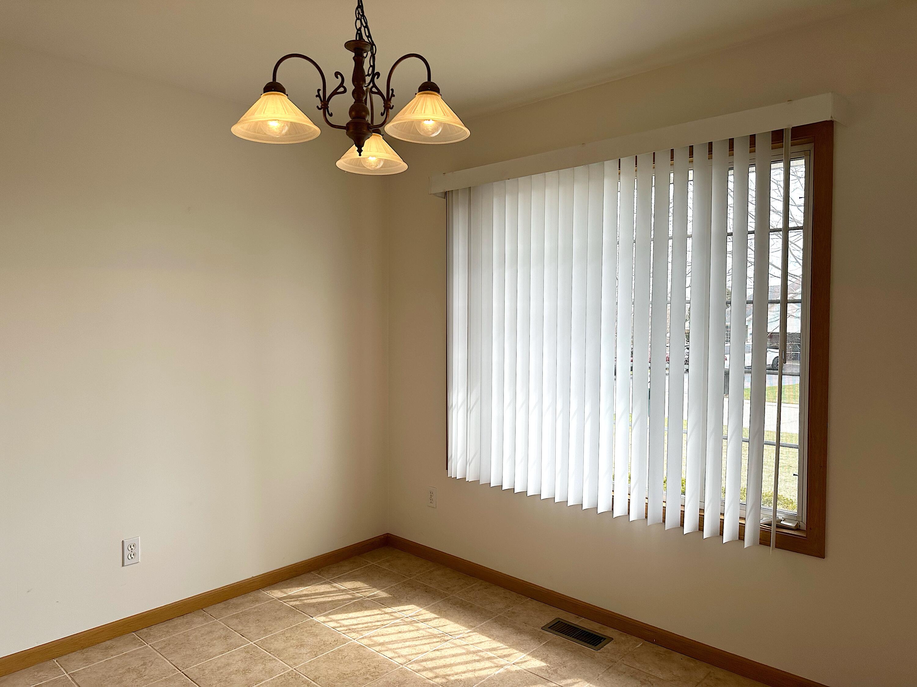 482 Fox Lane Walworth, WI 53184 - Photo 6 of 20 The Dining Area has a large window that overlooks the front yard and has a tile floor