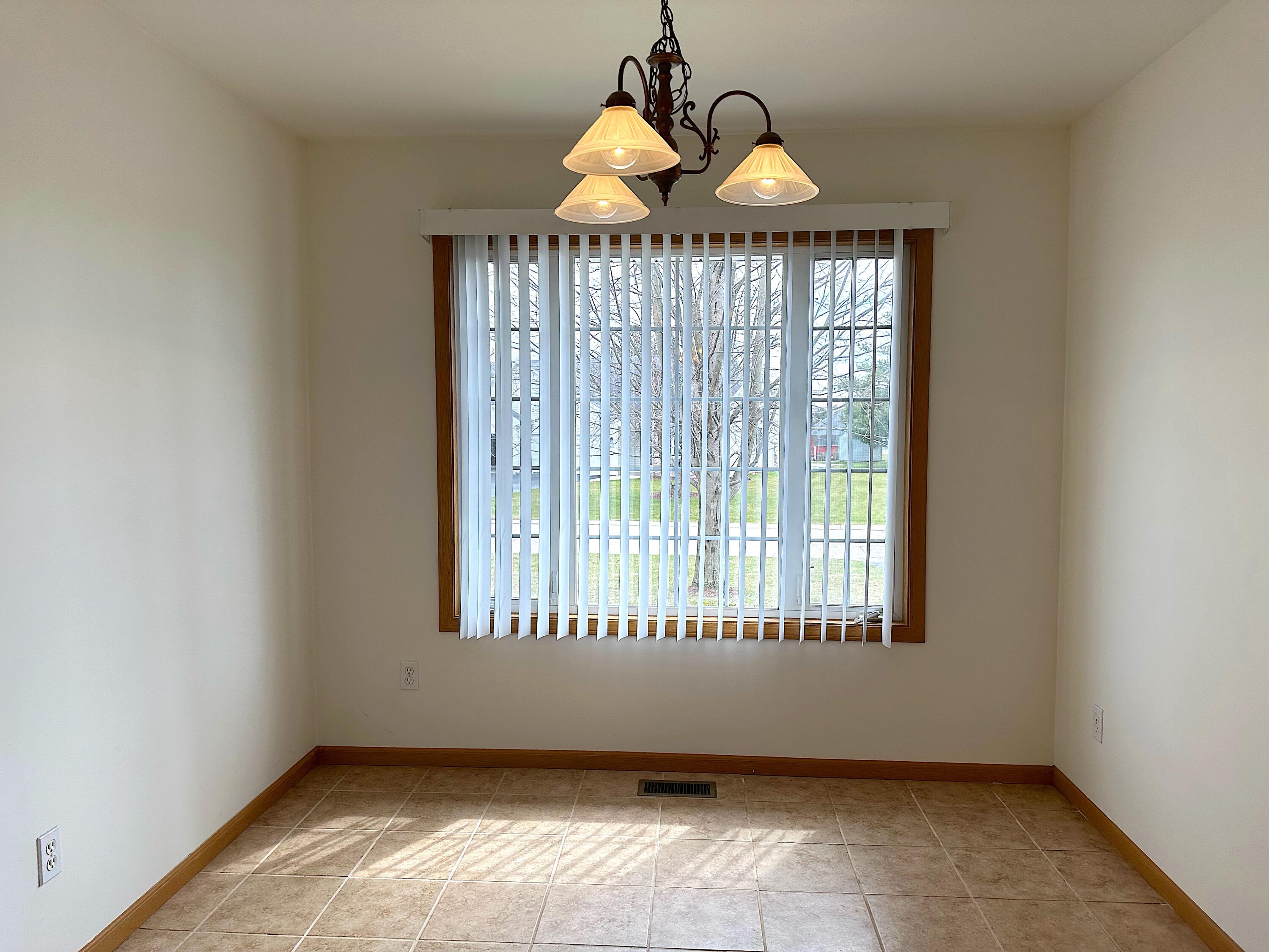 482 Fox Lane Walworth, WI 53184 - Photo 7 of 20 The Dining Area is open to the kitchen for a sunny dine-in option