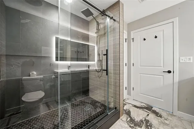 a hallway with a large stone stairs