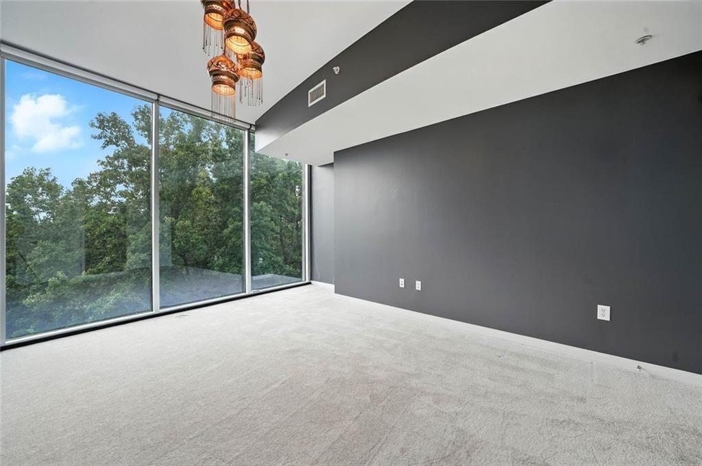 3300 Windy Ridge Parkway Southeast, Unit 711 Atlanta, GA 30339 - Photo 21 of 37 a view of a room with a large window