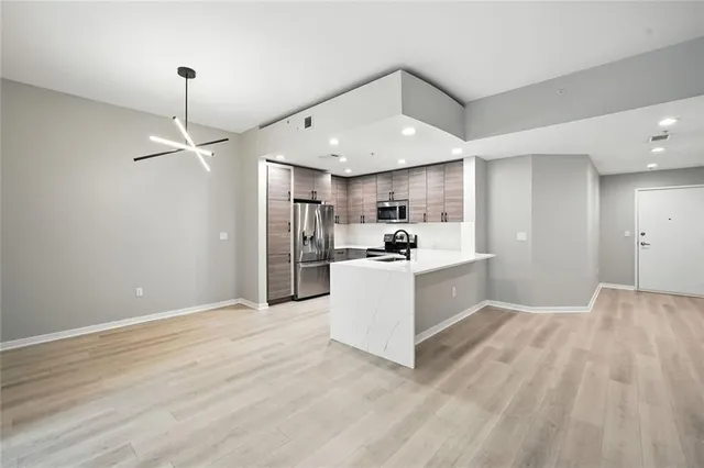 a spacious bathroom with a double vanity sink and a mirror