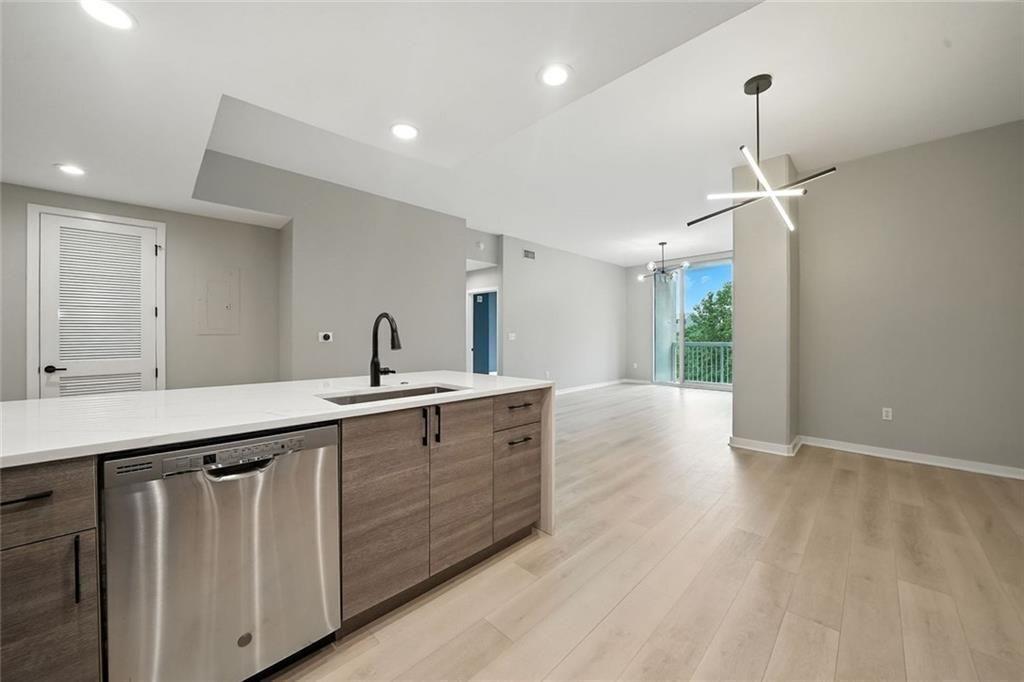 3300 Windy Ridge Parkway Southeast, Unit 711 Atlanta, GA 30339 - Photo 6 of 37 a spacious bathroom with a double vanity sink and a mirror