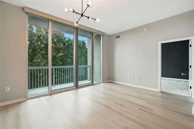 a bathroom with a sink toilet double vanity and shower