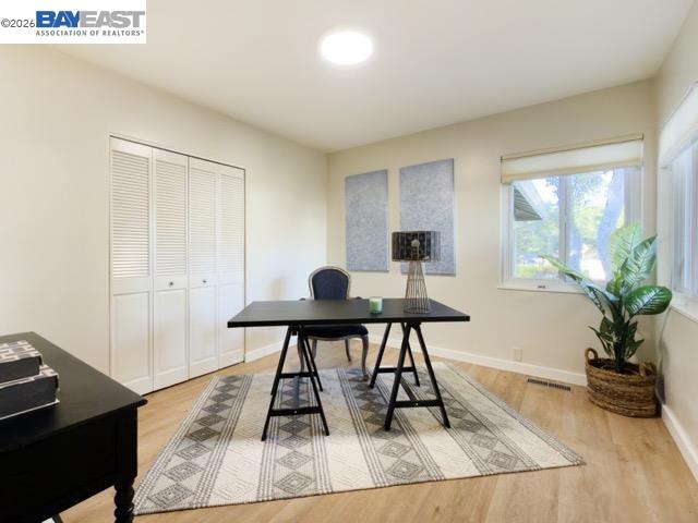 743 Marino Pines Road Pacific Grove, CA 93950 - Photo 15 of 28 a view of a workspace room with wooden floor and windows