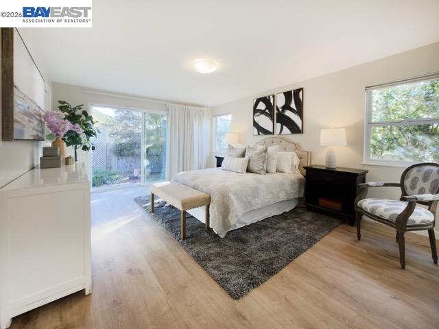 743 Marino Pines Road Pacific Grove, CA 93950 - Photo 19 of 28 a bedroom with a bed and a large window