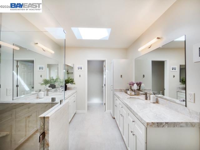 743 Marino Pines Road Pacific Grove, CA 93950 - Photo 24 of 28 a bathroom with a granite countertop double vanity sink and mirror