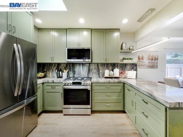 743 Marino Pines Road Pacific Grove, CA 93950 - Photo 9 of 28 a kitchen with stainless steel appliances granite countertop a sink stove and refrigerator