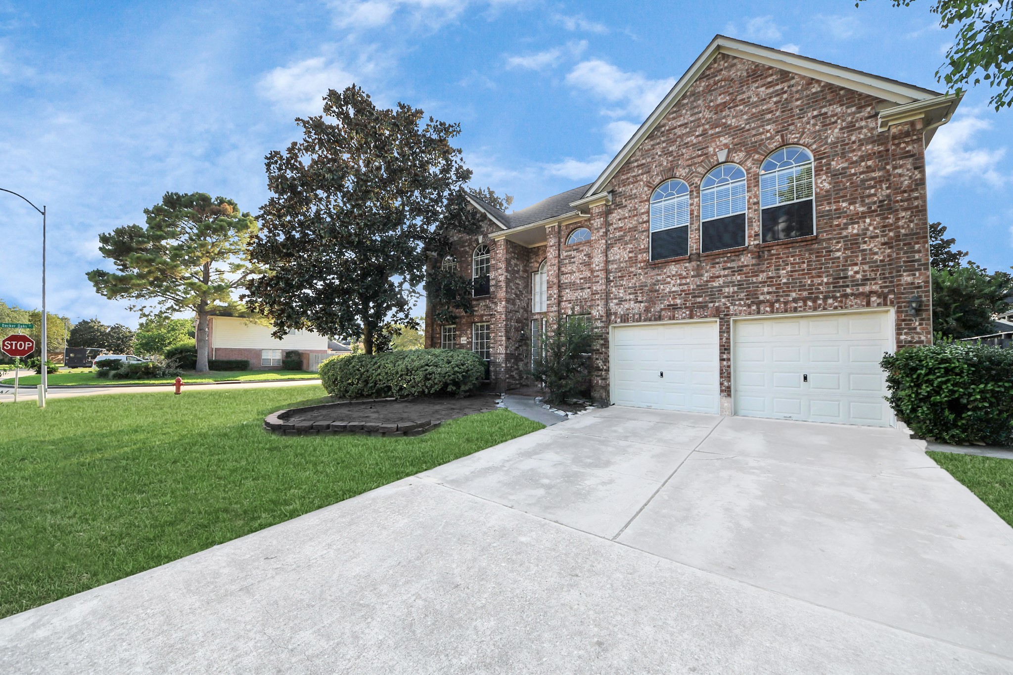 11918 Helene Court Pinehurst, TX 77362 - Photo 2 of 50 a house view with a garden space