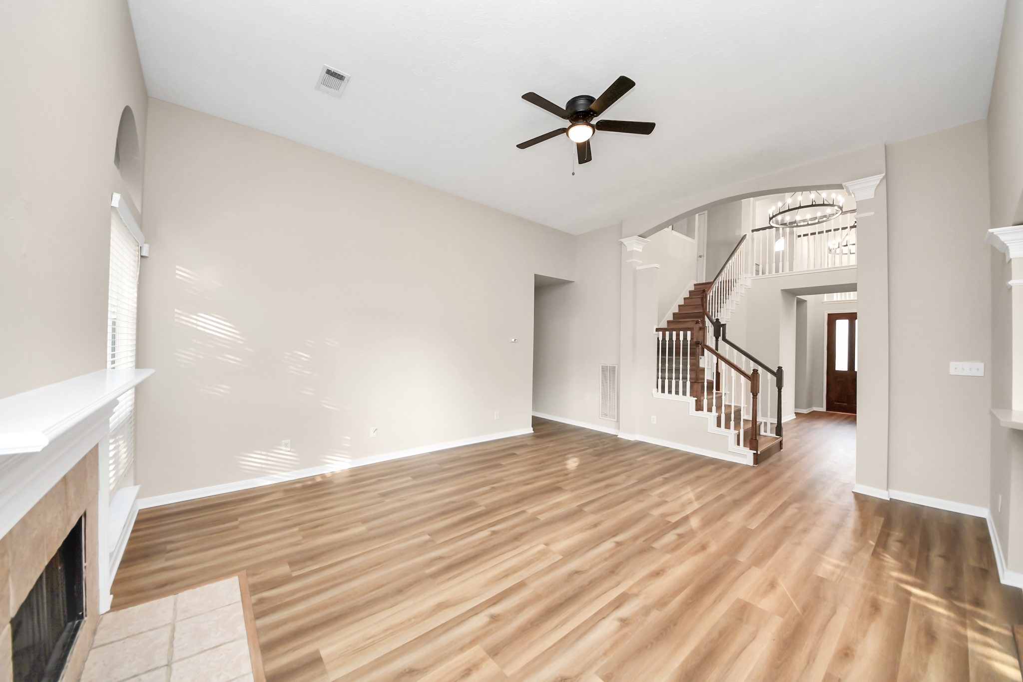 11918 Helene Court Pinehurst, TX 77362 - Photo 23 of 50 a view of an empty room with wooden floor and a window