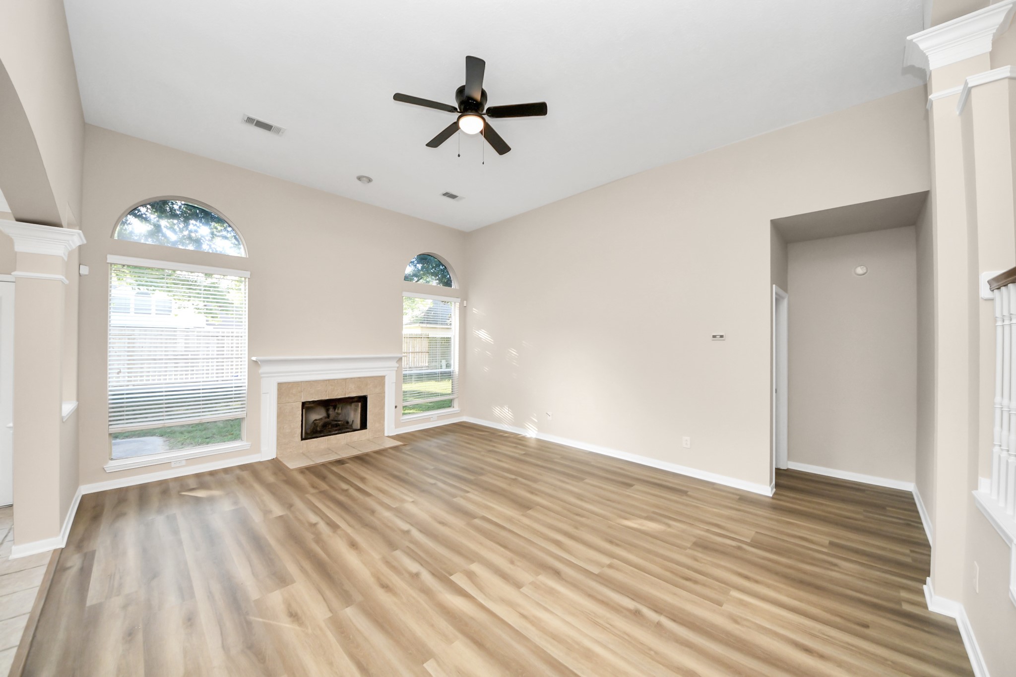 11918 Helene Court Pinehurst, TX 77362 - Photo 25 of 50 wooden floor in an empty room with a fireplace