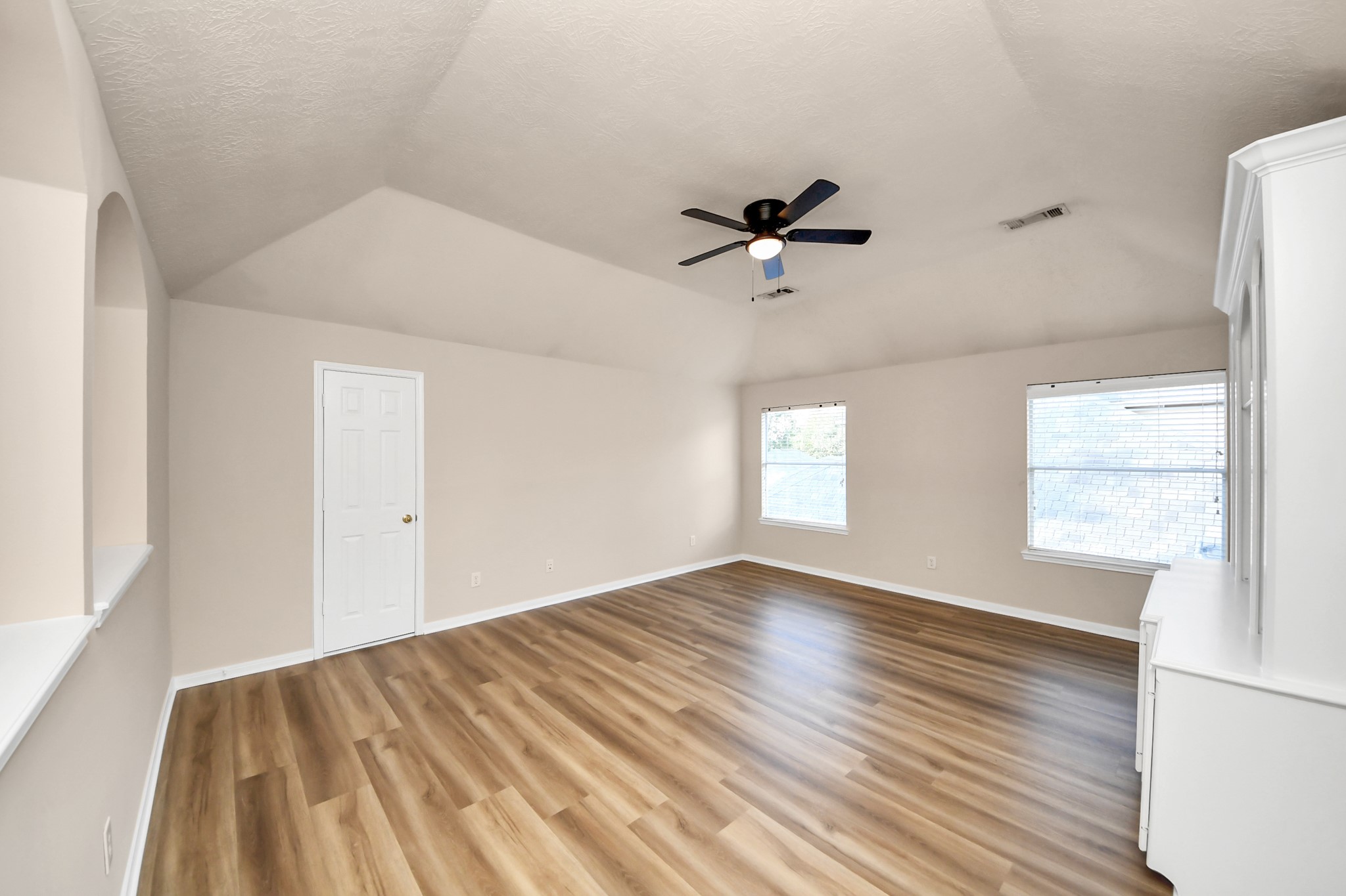 11918 Helene Court Pinehurst, TX 77362 - Photo 33 of 50 a view of empty room with wooden floor and fan