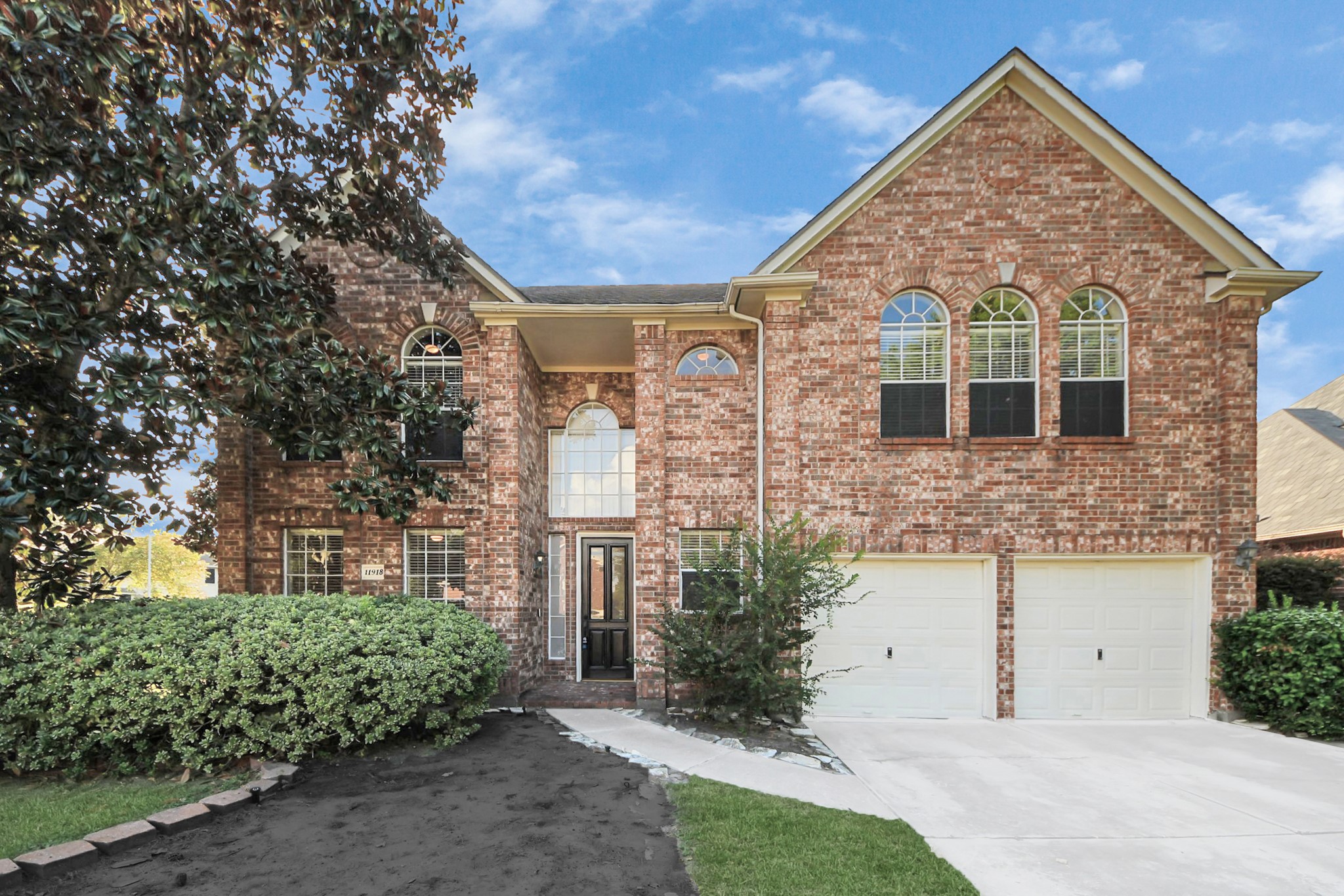 11918 Helene Court Pinehurst, TX 77362 - Photo 42 of 50 a front view of a house with a garden