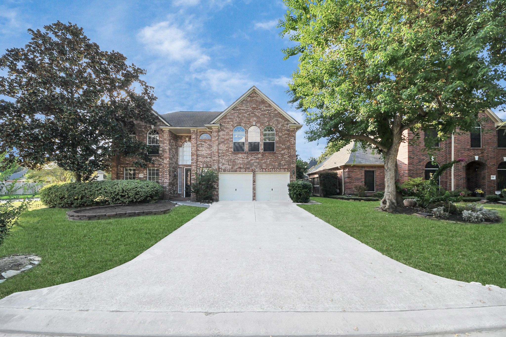 11918 Helene Court Pinehurst, TX 77362 - Photo 44 of 50 a front view of a house with a yard and garage