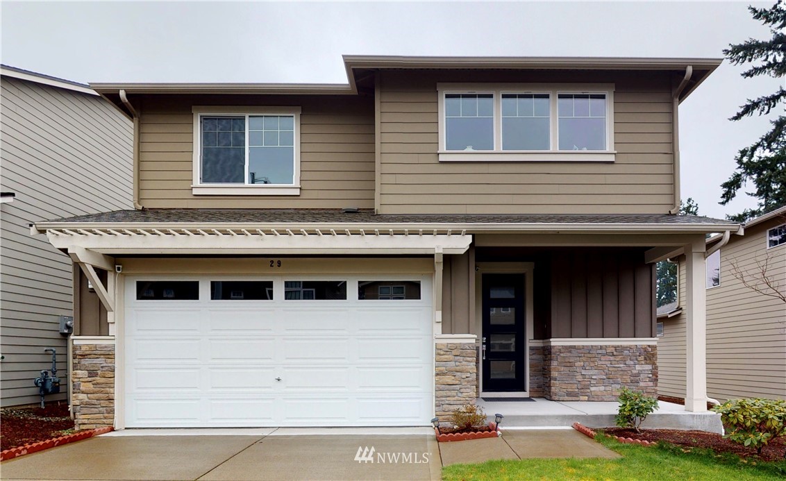 29 175th Place Southeast Bothell, WA 98012 - Photo 1 of 19 a front view of a house with garden