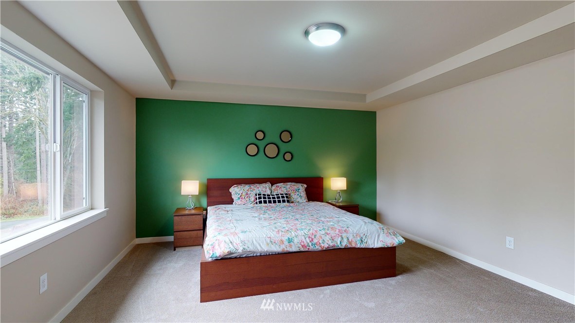 29 175th Place Southeast Bothell, WA 98012 - Photo 14 of 19 a bedroom with a bed and a window