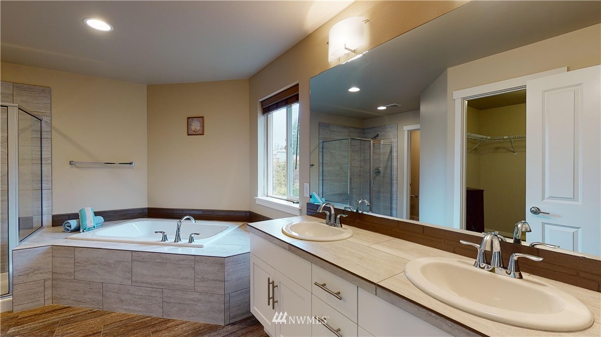 29 175th Place Southeast Bothell, WA 98012 - Photo 15 of 19 a bathroom with a double vanity sink and a mirror