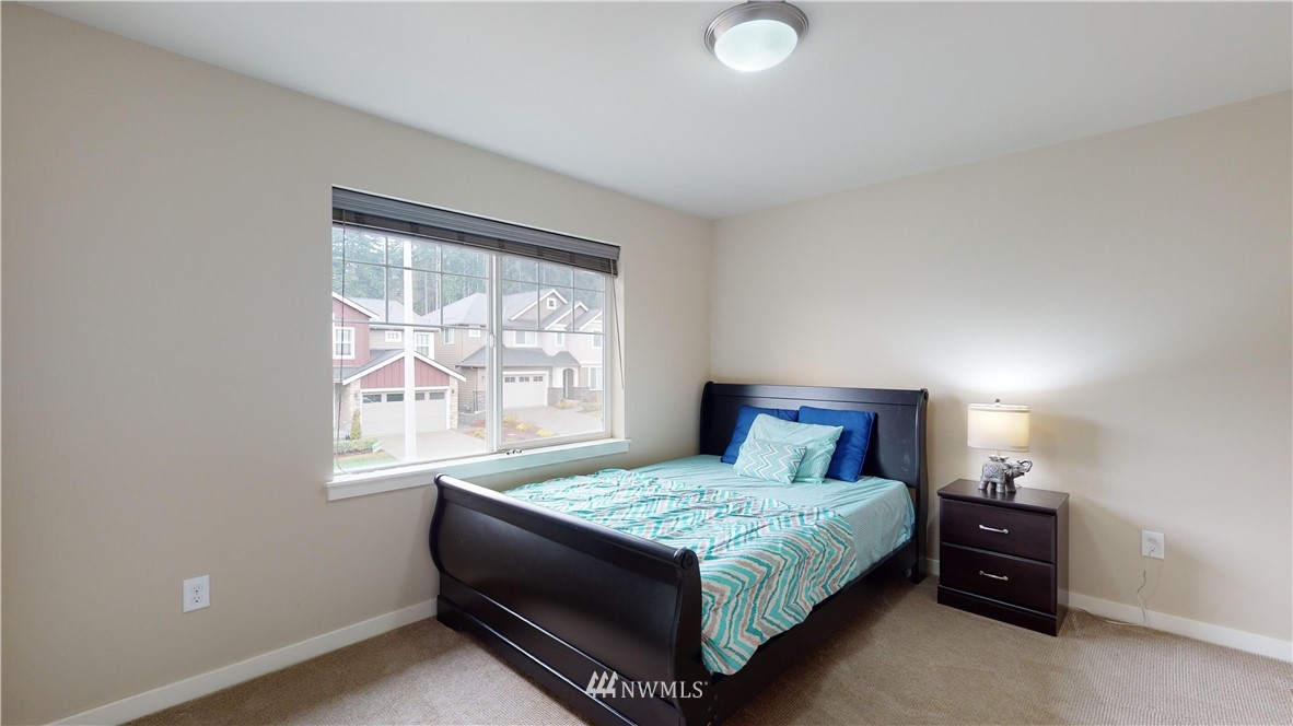 29 175th Place Southeast Bothell, WA 98012 - Photo 16 of 19 a bedroom with a bed and window