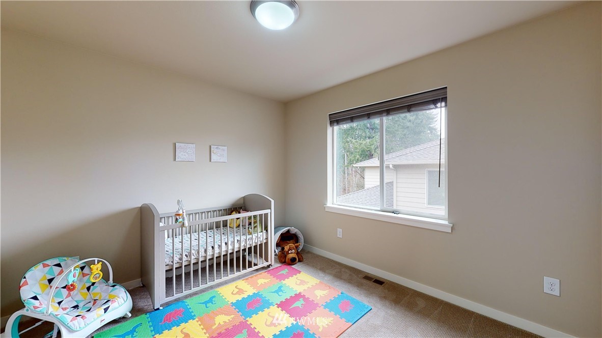 29 175th Place Southeast Bothell, WA 98012 - Photo 17 of 19 a bedroom with furniture a baby crib and a window
