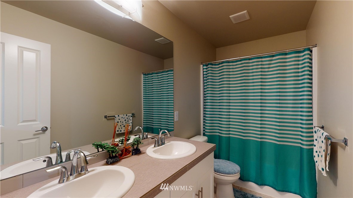 29 175th Place Southeast Bothell, WA 98012 - Photo 19 of 19 a bathroom with a sink a toilet and mirror