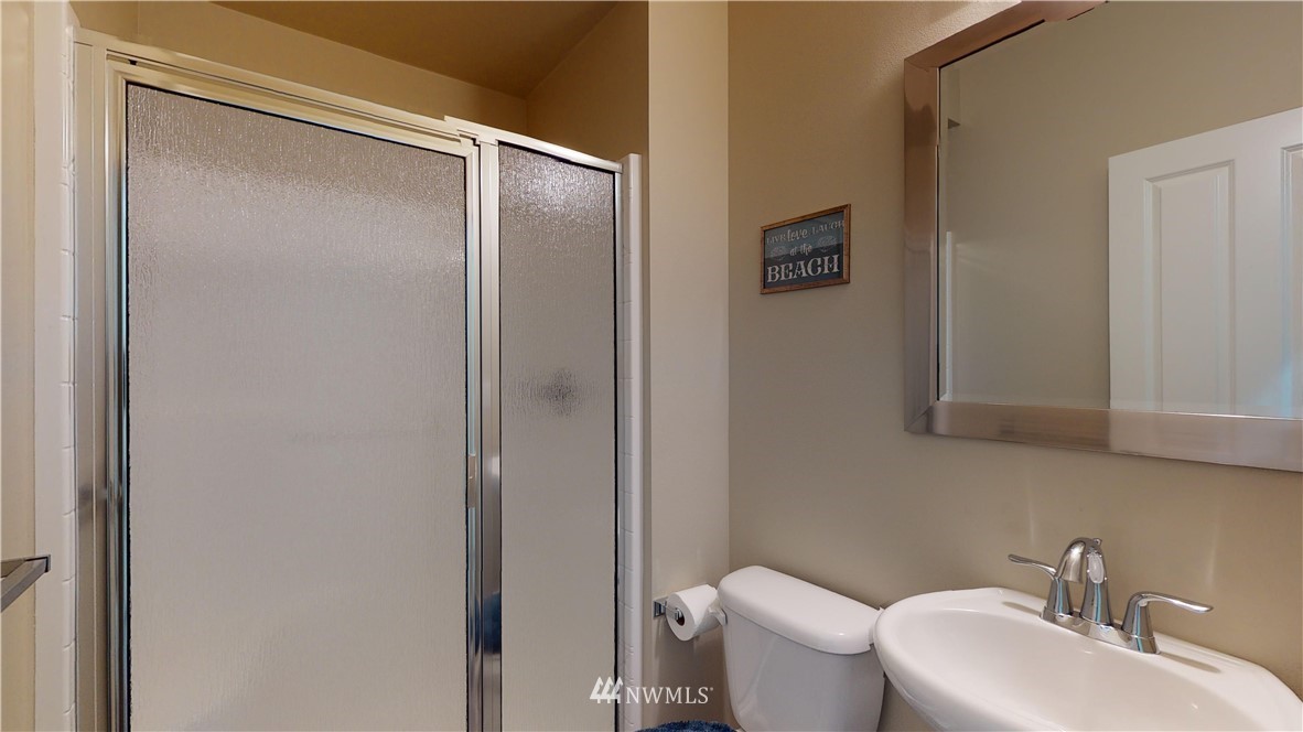 29 175th Place Southeast Bothell, WA 98012 - Photo 9 of 19 a bathroom with a sink mirror and toilet