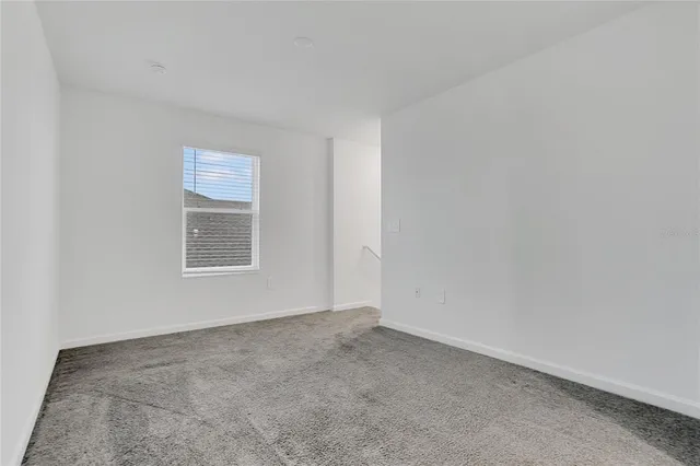 a bathroom with a shower sink and mirror