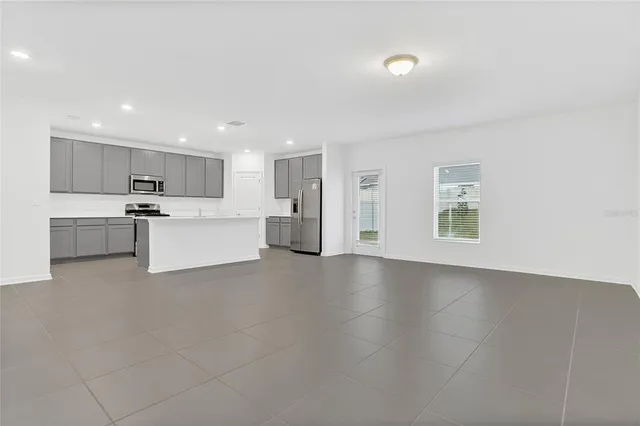 a view of a kitchen with a sink cabinets and a window
