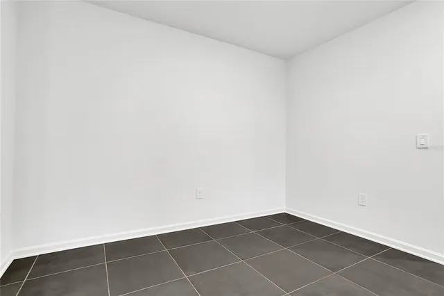 a kitchen with stainless steel appliances granite countertop a stove top oven a sink and dishwasher a refrigerator with wooden floor