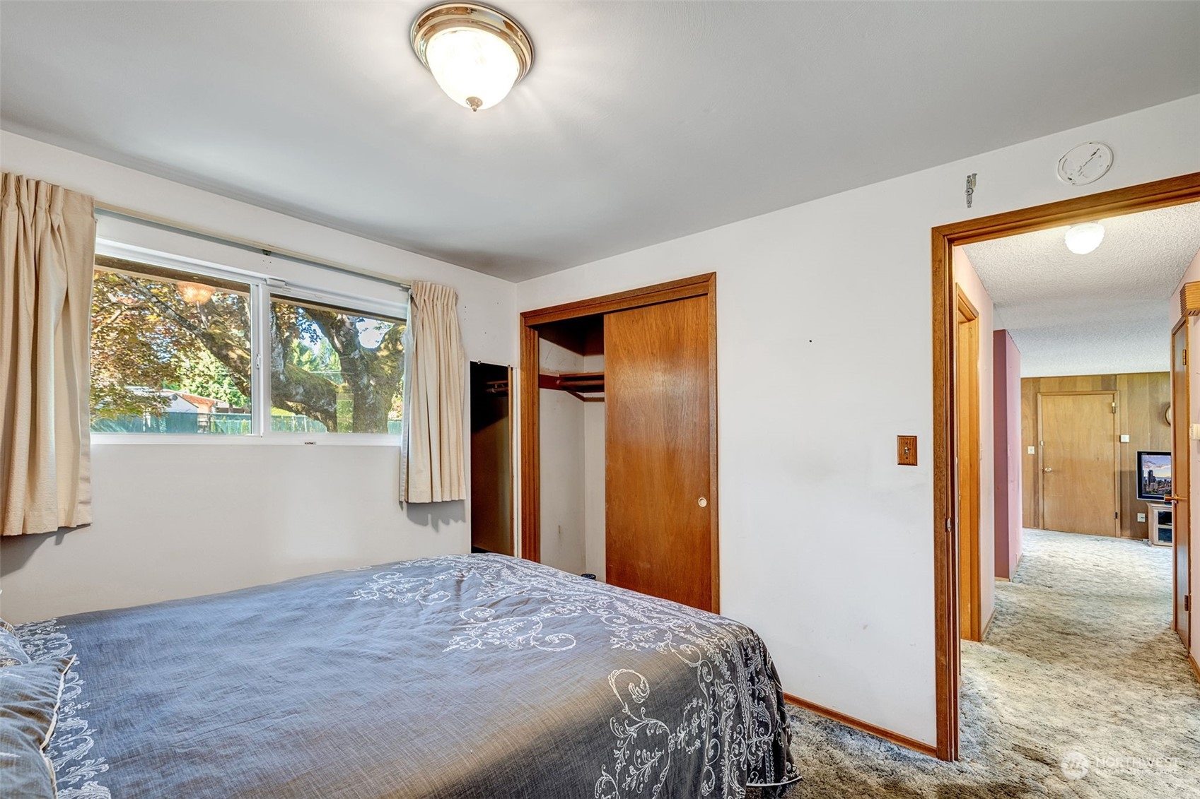 4109 Northeast 10th Place Renton, WA 98059 - Photo 16 of 27 a bedroom with a bed and a window