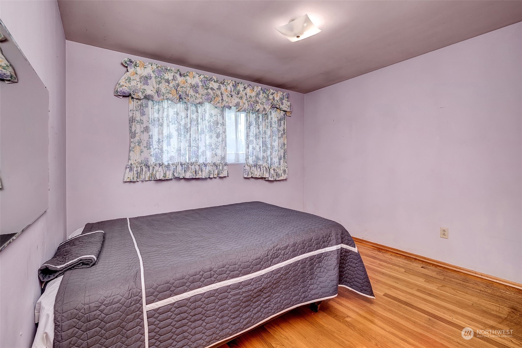 4109 Northeast 10th Place Renton, WA 98059 - Photo 17 of 27 a bedroom with a bed and a window