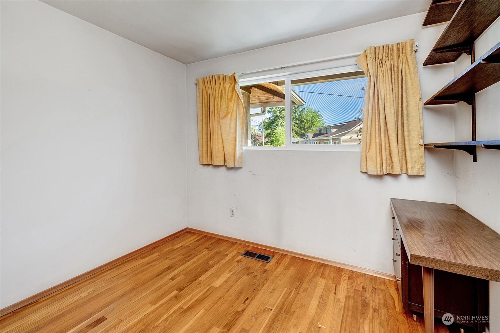 4109 Northeast 10th Place Renton, WA 98059 - Photo 18 of 27 a view of a room with wooden floor and a window