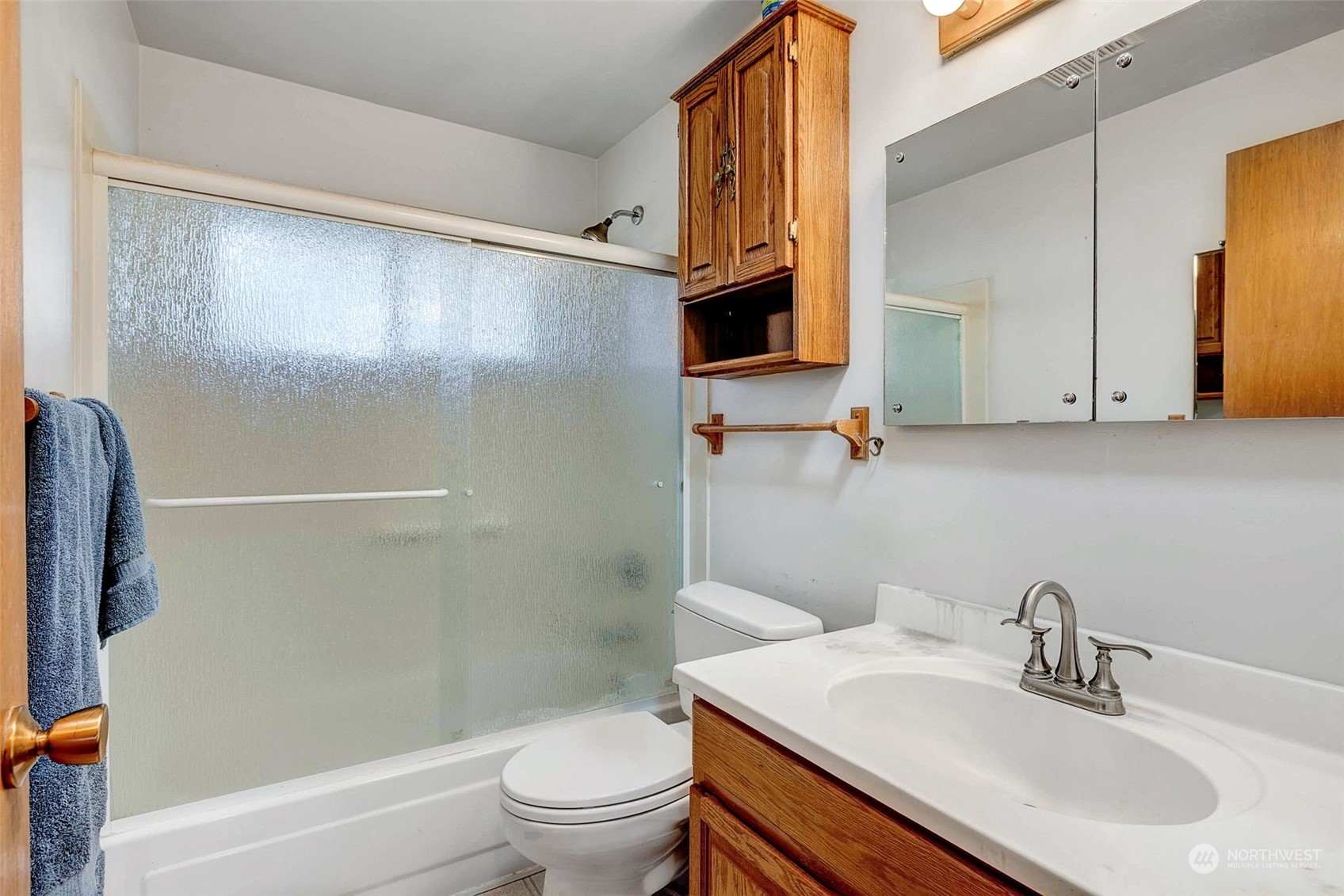 4109 Northeast 10th Place Renton, WA 98059 - Photo 20 of 27 a bathroom with a sink toilet and shower