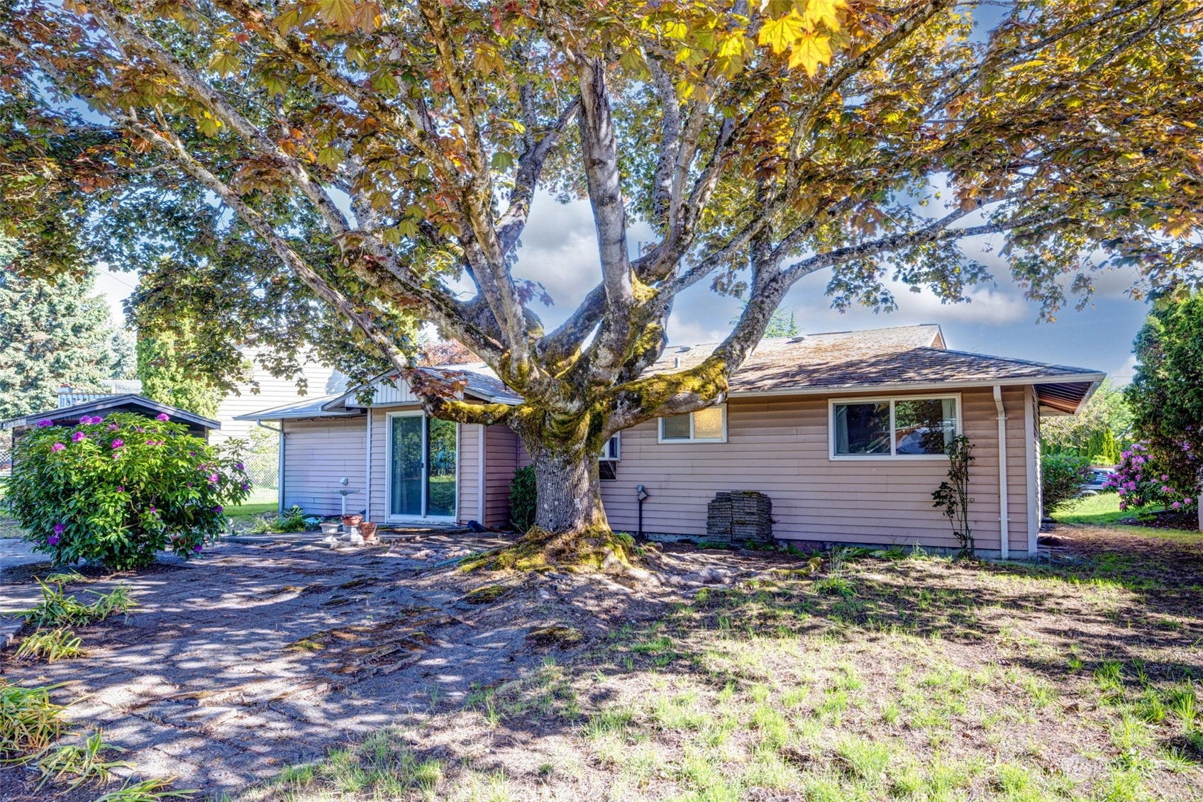 4109 Northeast 10th Place Renton, WA 98059 - Photo 22 of 27 a view of a house with a yard