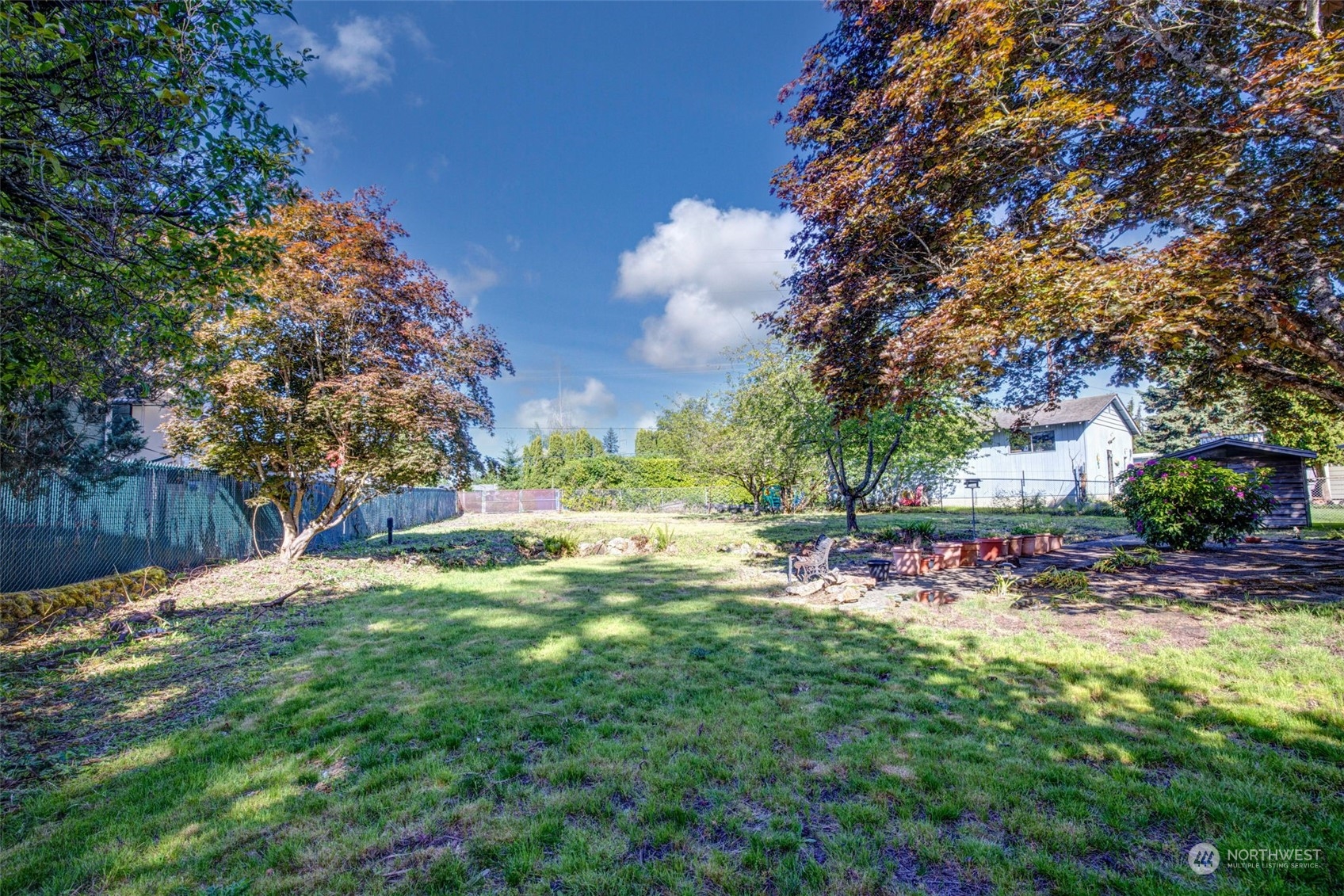 4109 Northeast 10th Place Renton, WA 98059 - Photo 24 of 27 a view of a backyard with tree s
