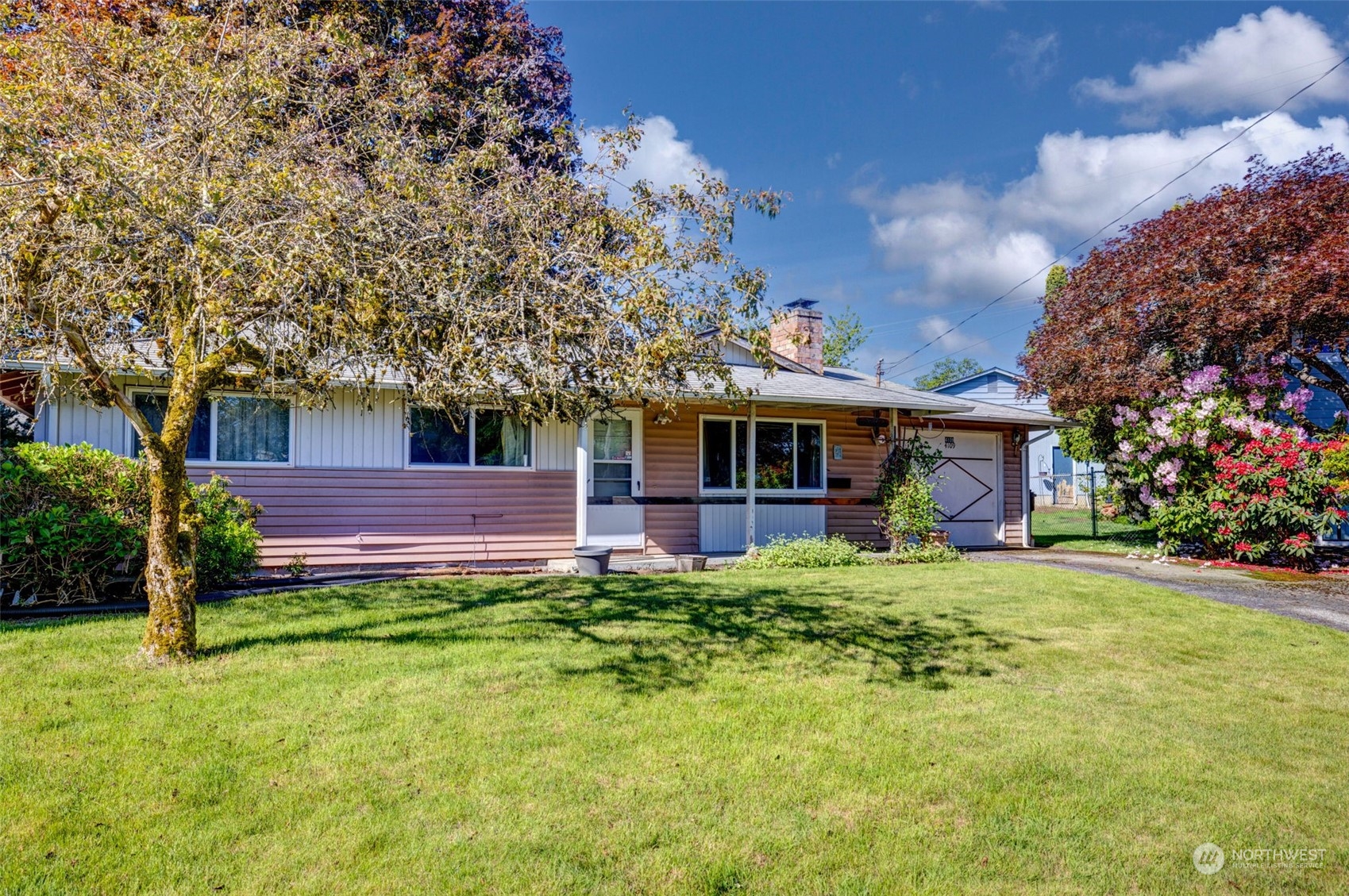 4109 Northeast 10th Place Renton, WA 98059 - Photo 3 of 27 a view of a house with a yard