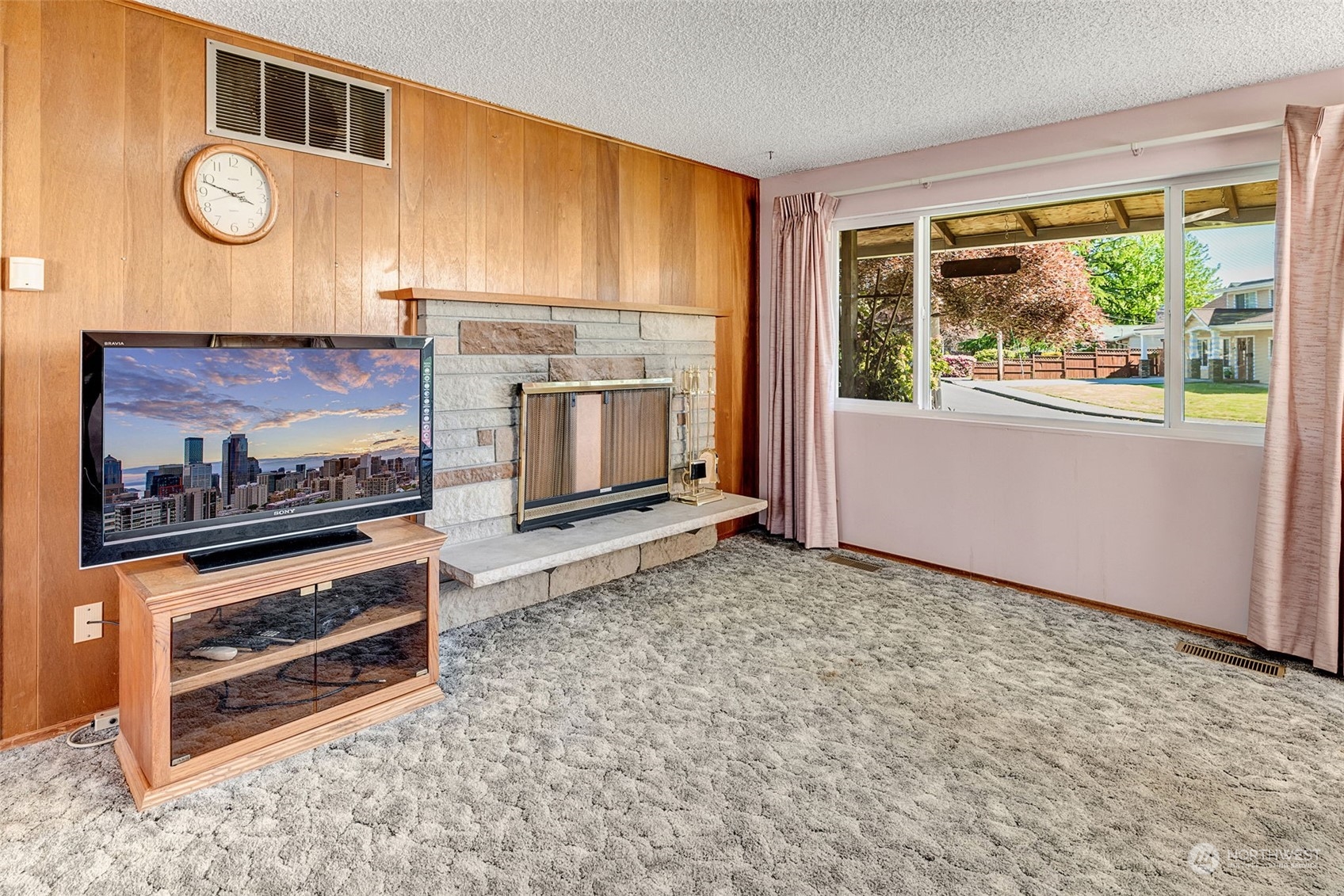 4109 Northeast 10th Place Renton, WA 98059 - Photo 7 of 27 a view of living room with furniture and a flat screen tv
