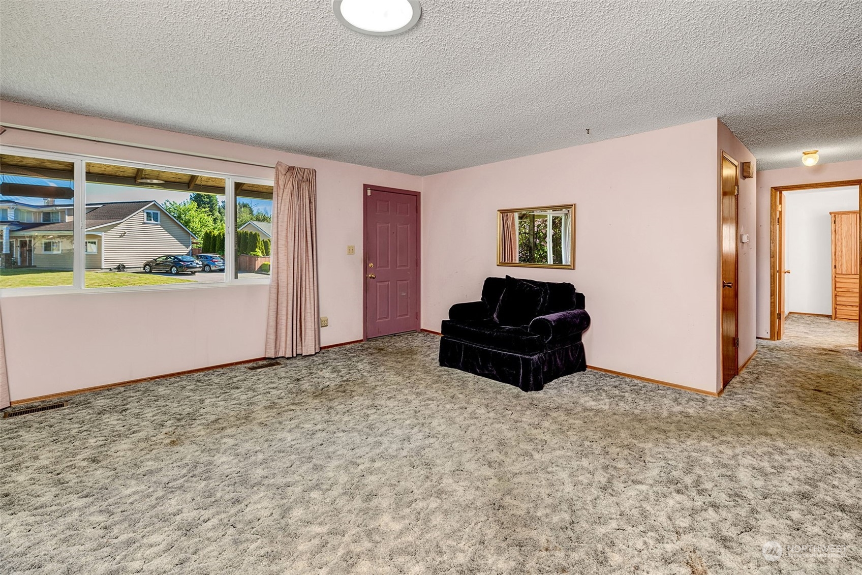 4109 Northeast 10th Place Renton, WA 98059 - Photo 8 of 27 a living room with furniture and a window