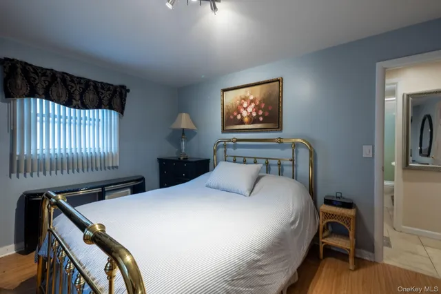 a bedroom with a bed and a table in it